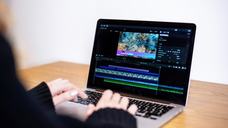 young content creator girl editing video her laptop working from home scaled 1
